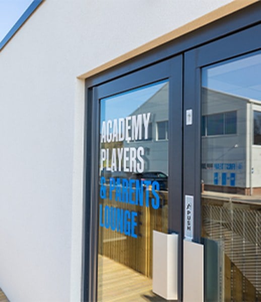 Glazed entrance door to the Academy Players and Parents Lounge at Huddersfield Town